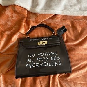 Un Voyage Black(clear) Purse